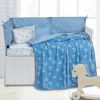 Child’s room with cloud wallpaper on blue wall